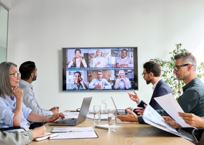 stock image of zoom and in-person meeting